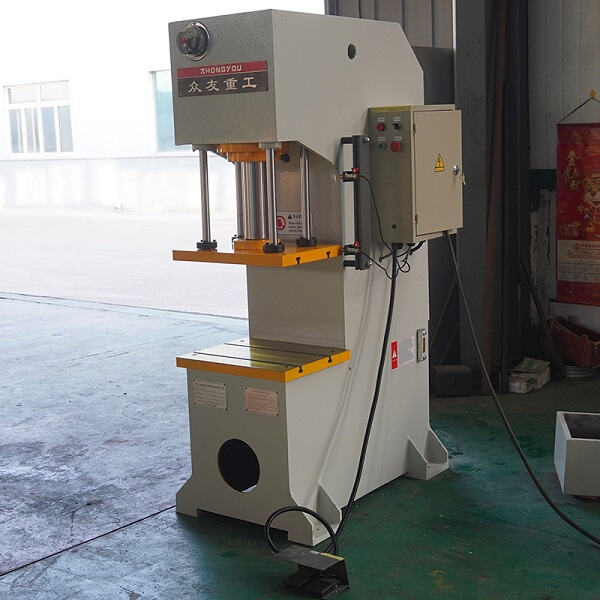 The single arm hydraulic press.