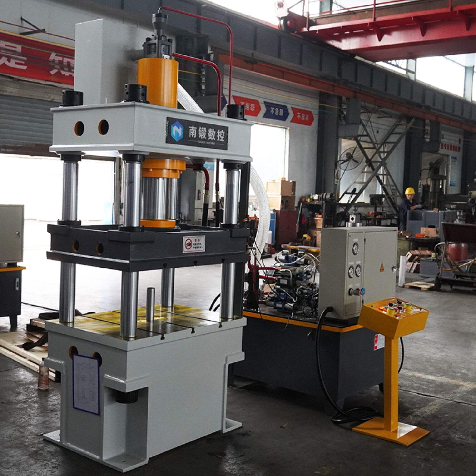 What are the safety features of a 200-ton three-beam four-column hydraulic press with a lower cylinder?