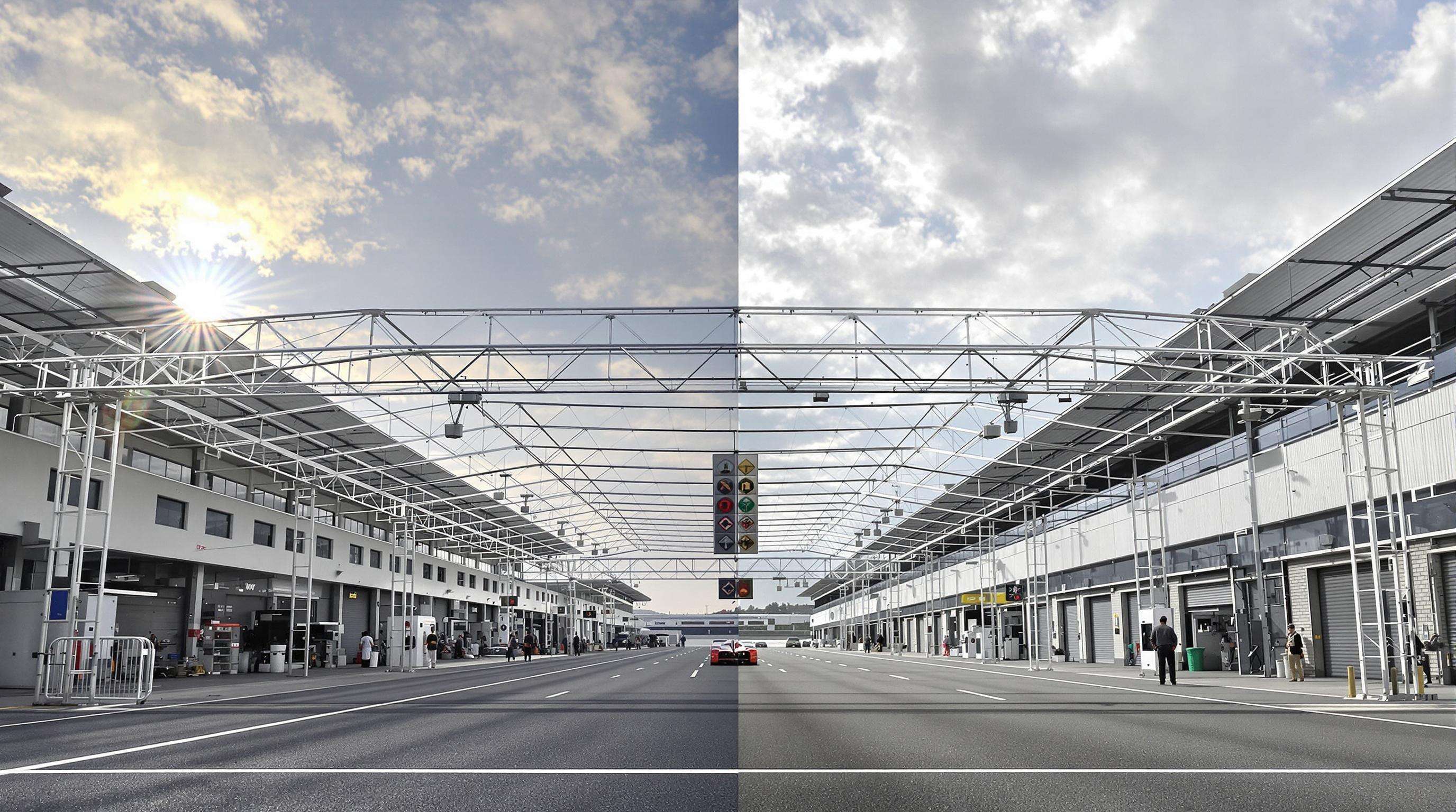 A realistic photo of two racing pit structures side-by-side, one made of lightweight aluminum truss and the other from heavier steel, in a motorsport paddock showing differences in structure bulk and environment.