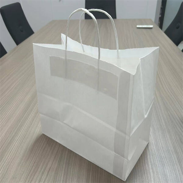 Bolsas de papel blancas con asas