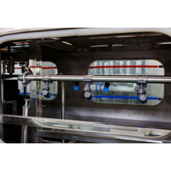 Automated system for filling oversized bottles