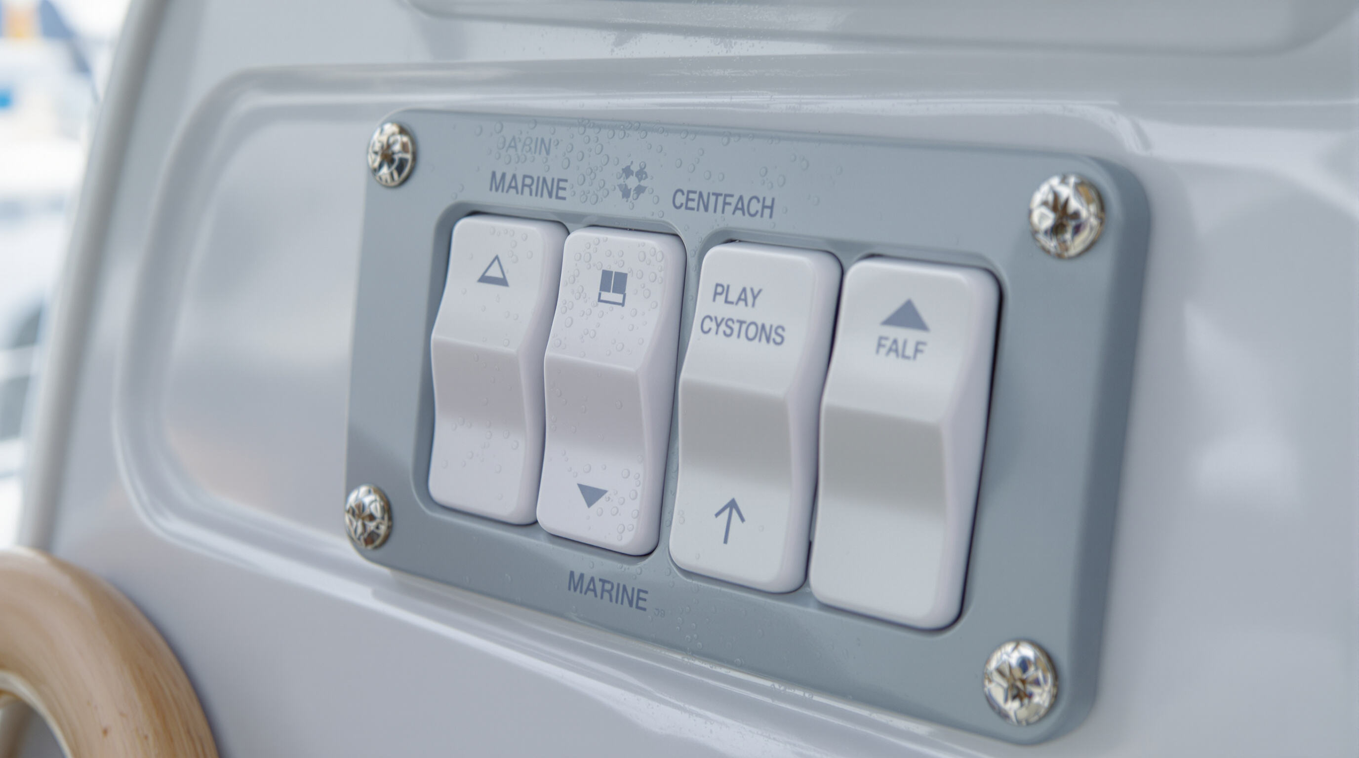 Close-up photo of a waterproof boat switch panel with water droplets and salt remnants on sealed surfaces.