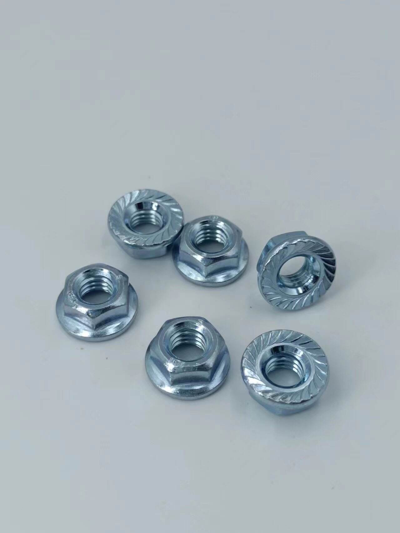 304 Stainless Steel Flange Nut 201Tooth locking 316 non-slip hexagonal flange nuts factory