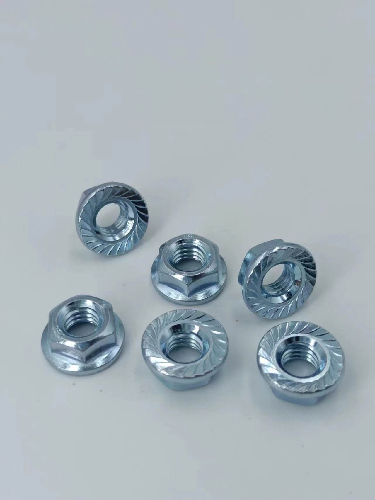 304 Stainless Steel Flange Nut 201Tooth locking 316 non-slip hexagonal flange nuts factory