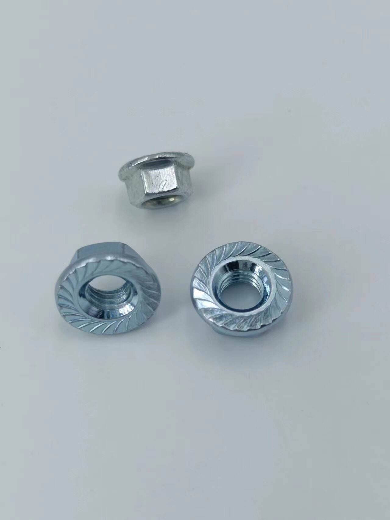 304 Stainless Steel Flange Nut 201Tooth locking 316 non-slip hexagonal flange nuts supplier