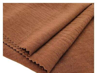 Scuba Crepe အထည်သည် ဖွဲ့စည်းတည်ဆောက်မှုပါရှိသော အဝတ်အစားဒီဇိုင်းများကို ပံ့ပိုးပေးပုံ