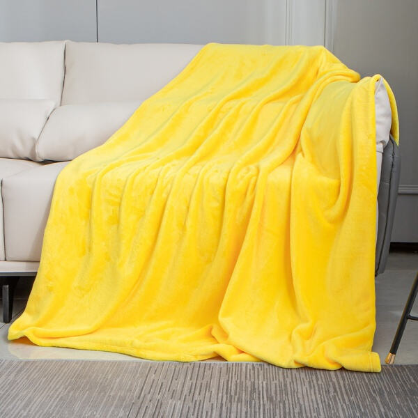 Wrap yourself up in sunshine with this yellow fleece throw