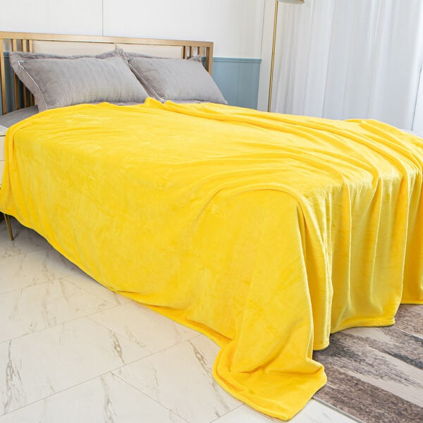 Sunny days ahead with our yellow fleece throw