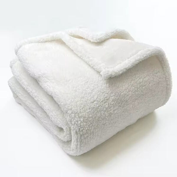 Indulge in the luxurious feel of our white Sherpa blanket, perfect for any season