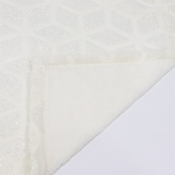 Unwind in ultimate softness with a white plush blanke