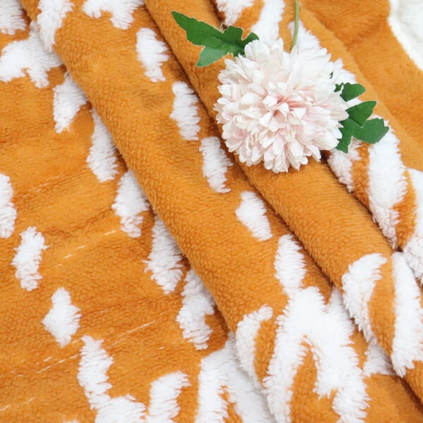 Stay warm and stylish with a Sherpa fleece blanket.