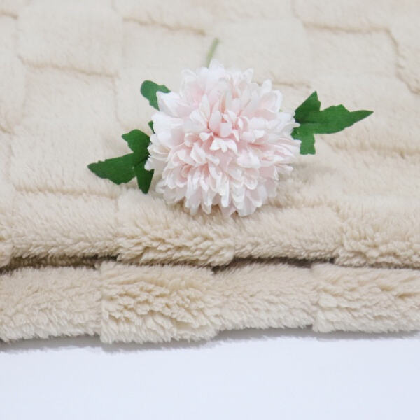 Snuggle in style with a fleece and sherpa throw