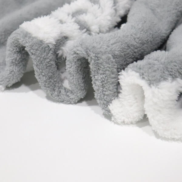 Get through winter with our warm sherpa fleece throw