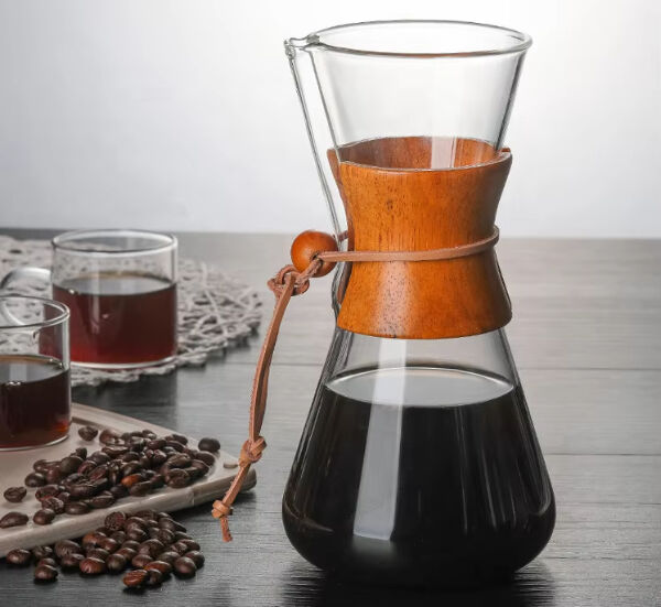 Enjoying the aroma and visual appeal of coffee brewing in a transparent glass p