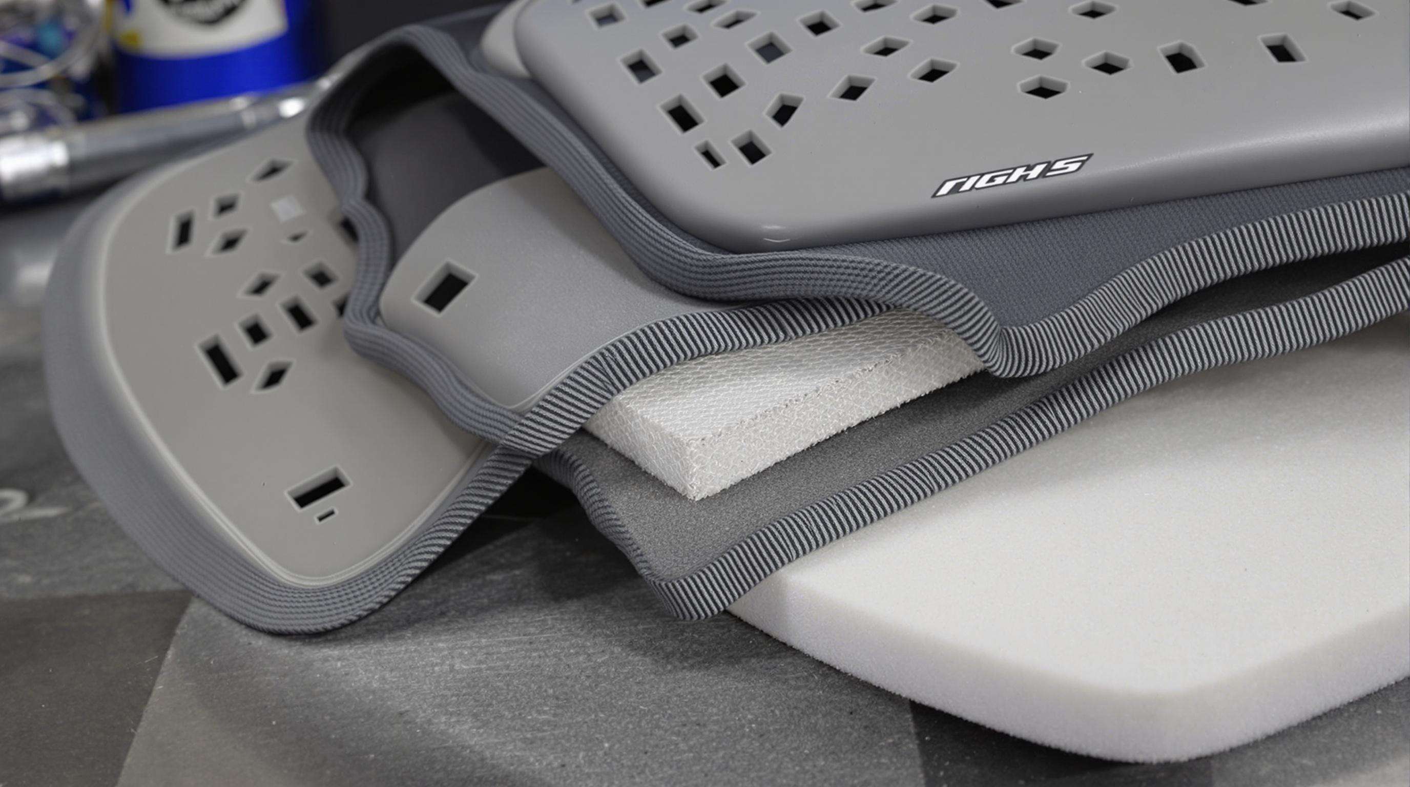 Close-up of back protector material layers including mesh, foam, and honeycomb structure