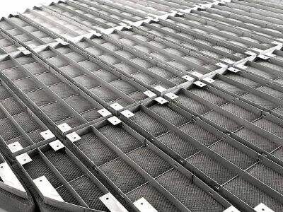 Efficient vapor liquid separation using pad demisters