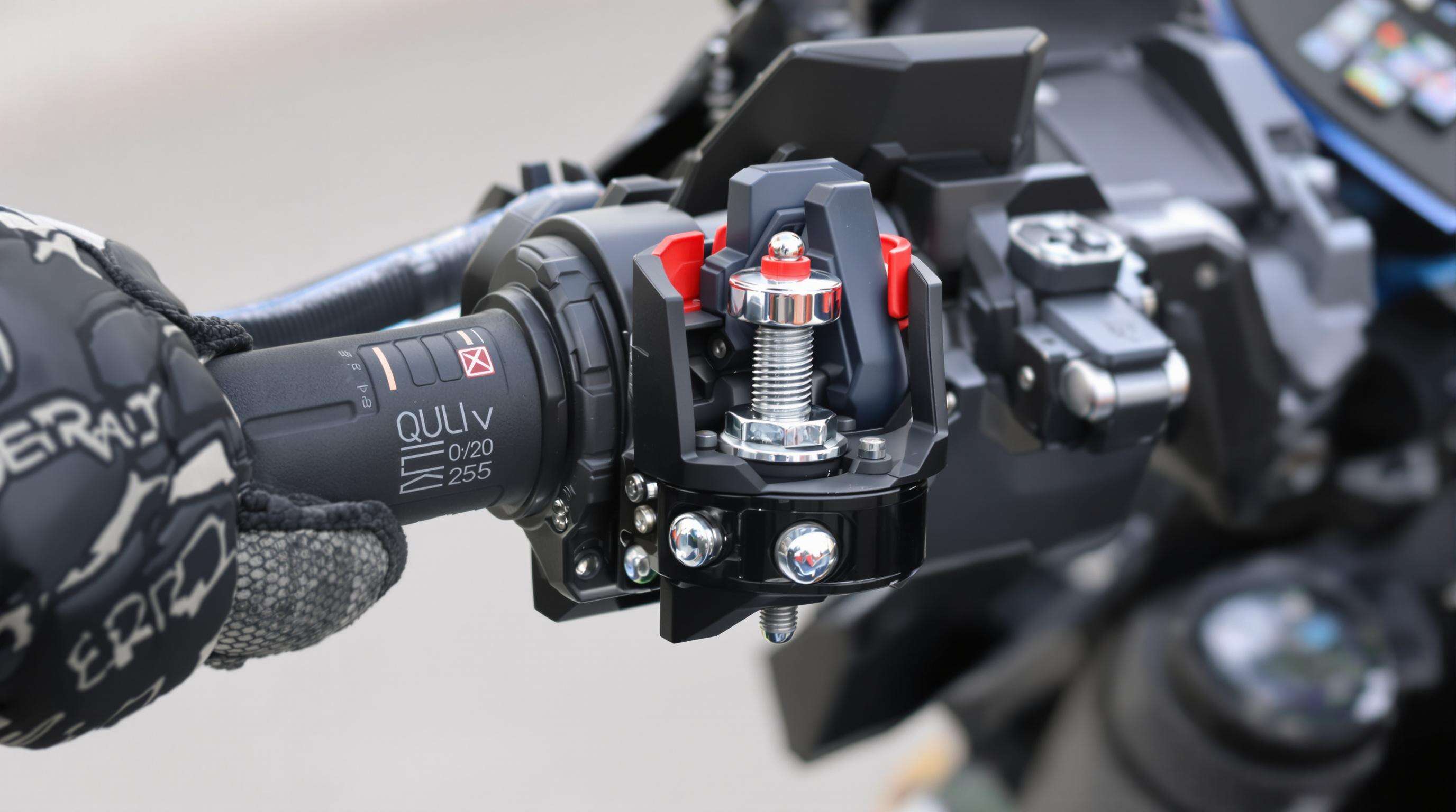 Gloved hand installing a motorcycle phone holder with a ball head screw and quick-lock mechanism