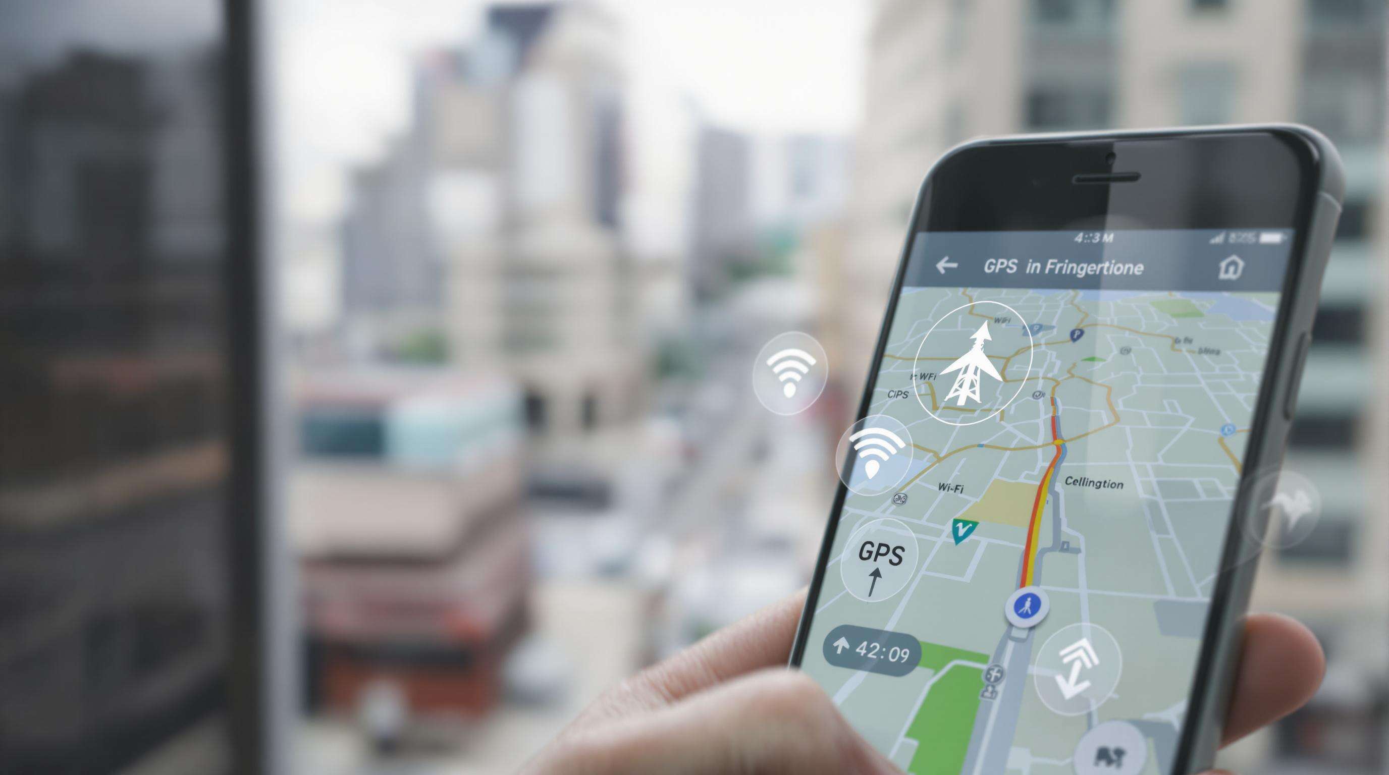 Smartphone showing GPS navigation, with subtle hints of satellite, Wi-Fi, and cellular tracking