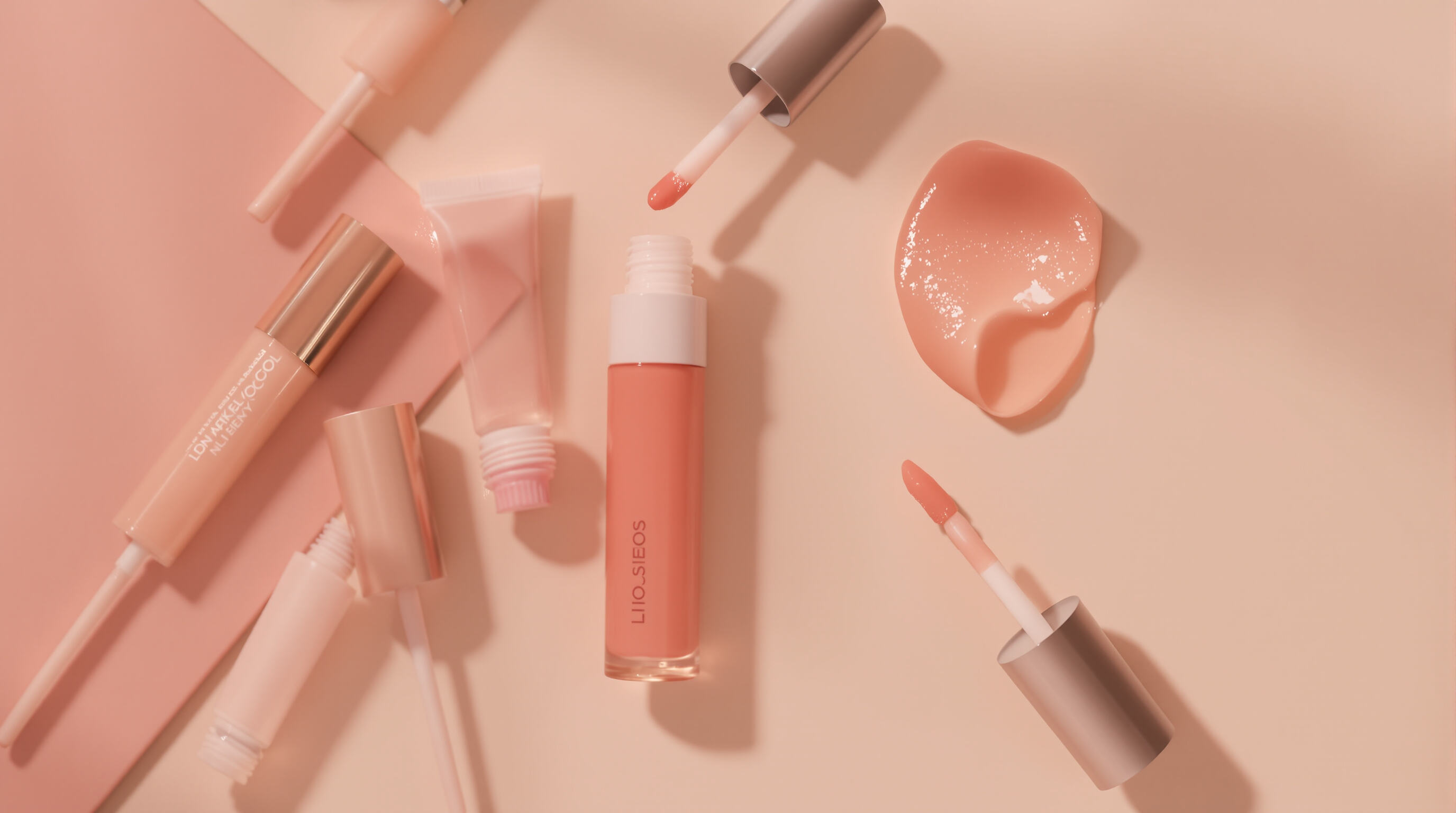 Modern lip gloss tubes with non-sticky formula and comfortable, luminous lips in a muted setting