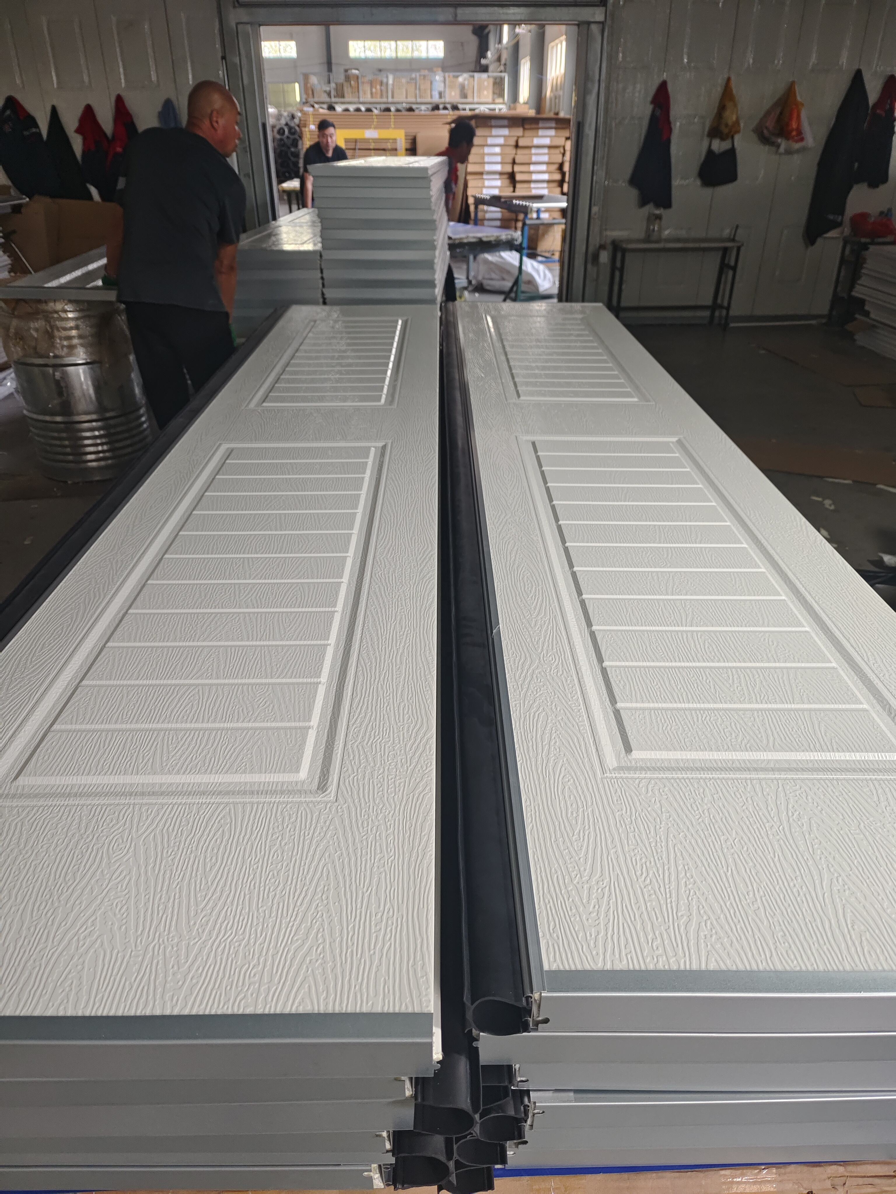 Wholesale Modern White Square Line Automatic Single Skin Steel Villa Garage Door Windproof with Finished Surface supplier