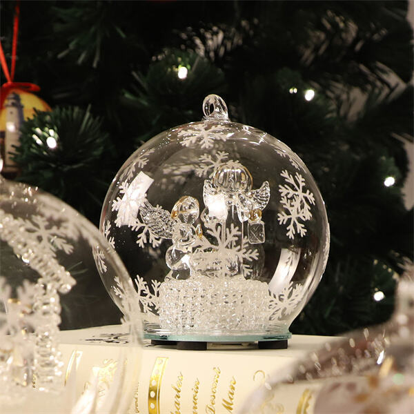 Catch a glimpse of serenity with an angel snow globe