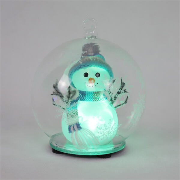 Watch as a charming snowman comes to life in your snow globe, perfect for any collector