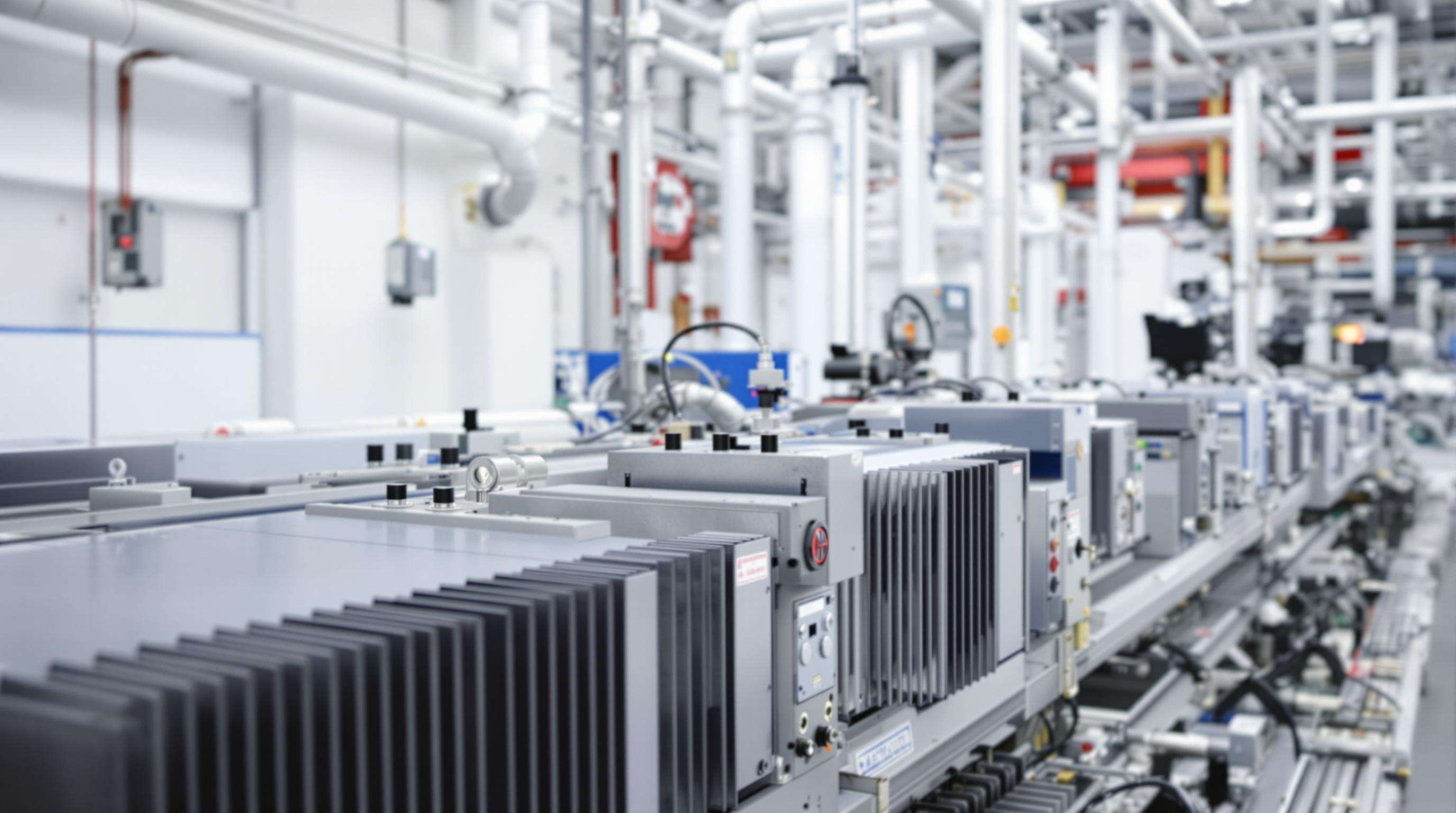 Passively cooled industrial laser system in a factory setting, showing compact thermal design without water cooling