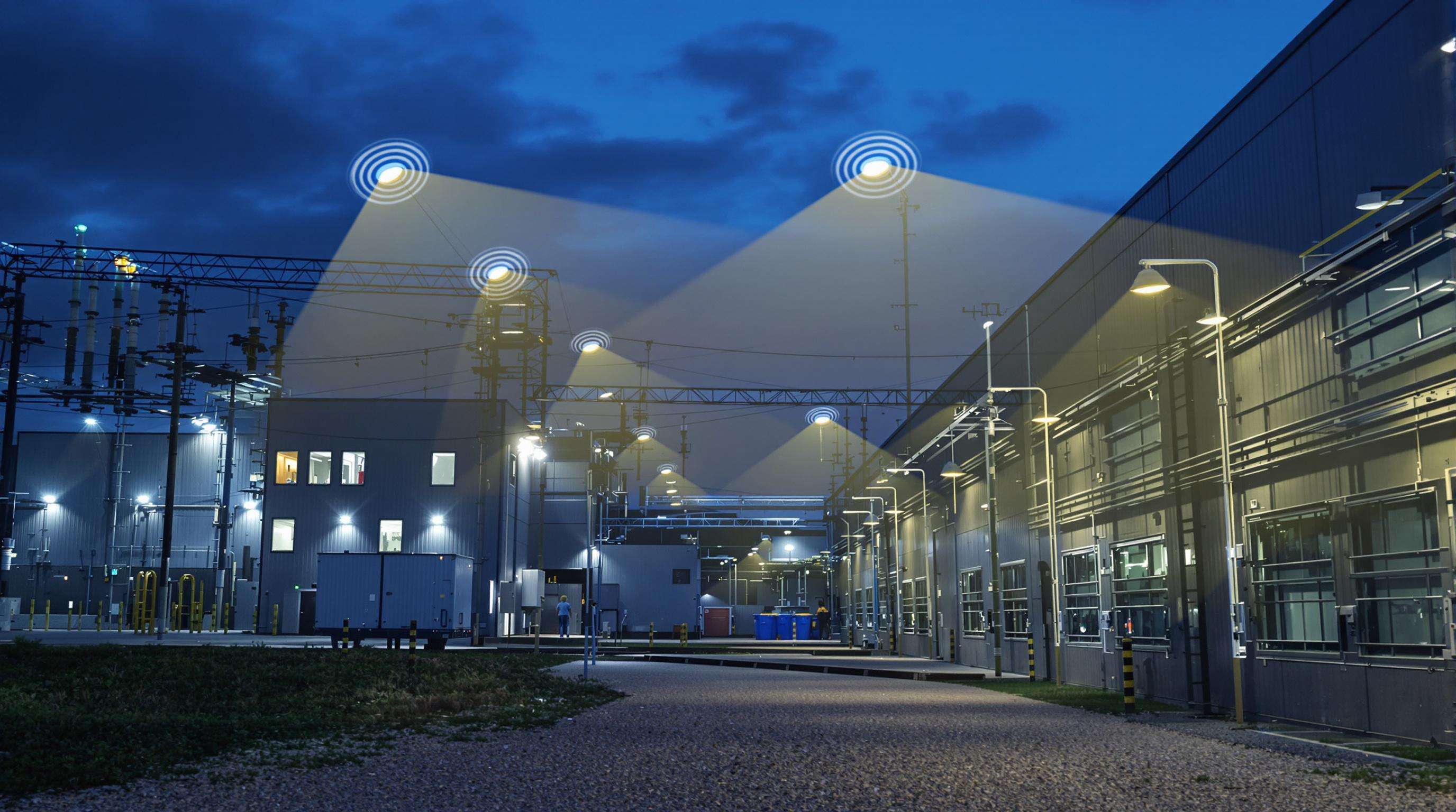 Modern industrial facility with smart photoelectric sensor networks adjusting lighting levels