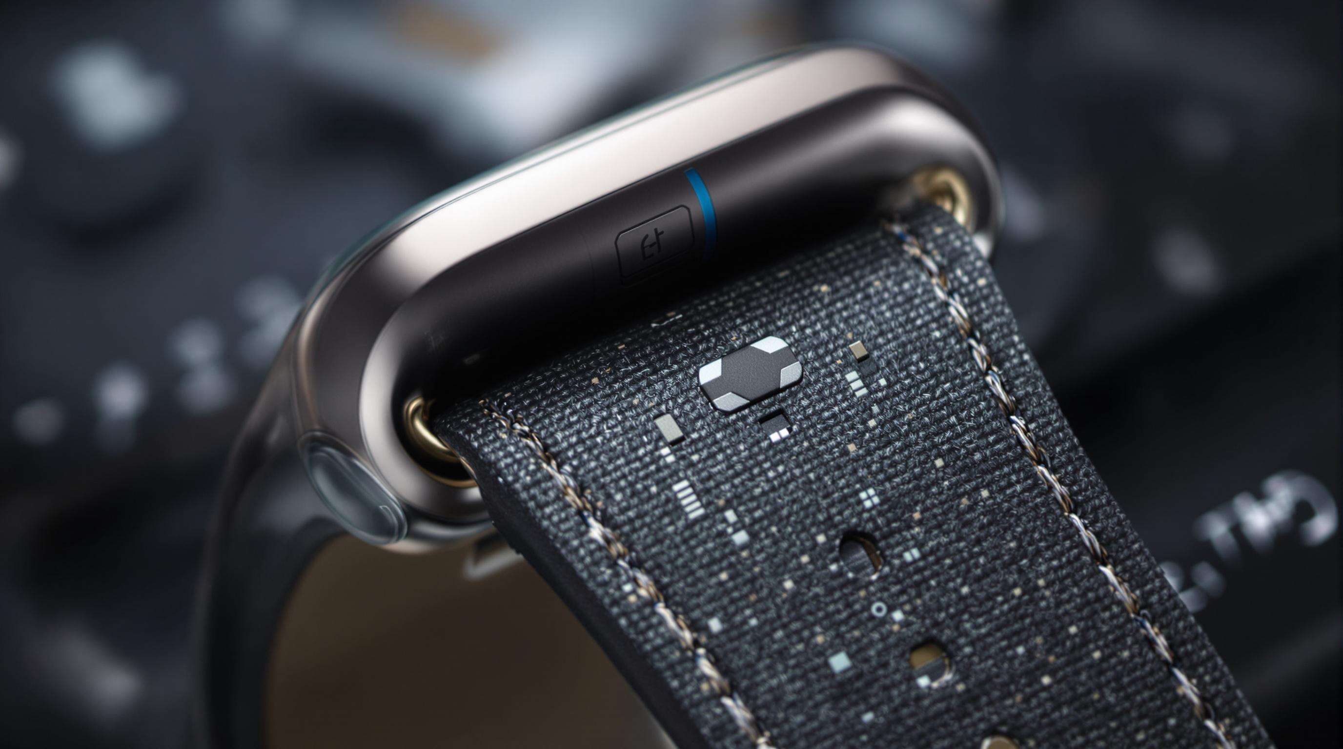 Close-up view of an artificial leather smartwatch band with visible embedded sensors and conductive threads, emphasizing technology integration in smart wearables.