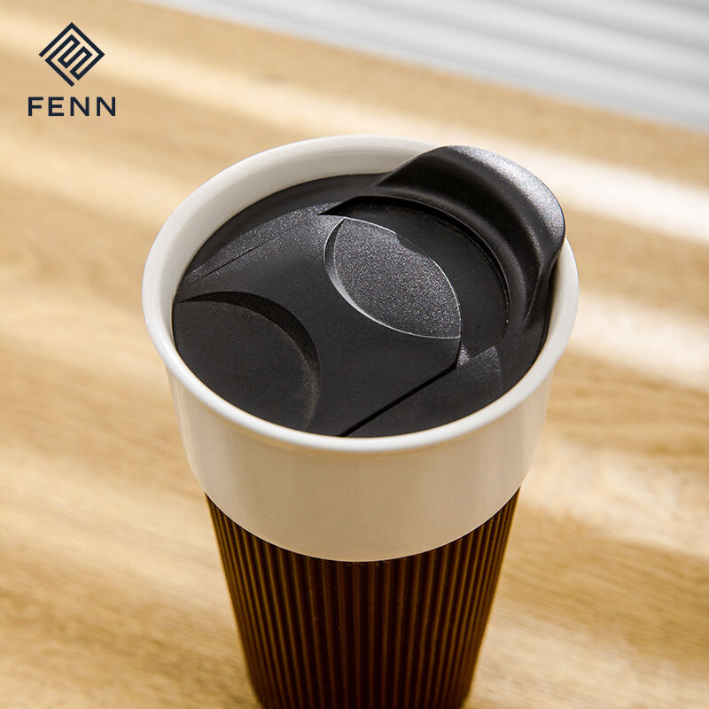 Reusable convenient handleless travel water mugs custom logo ceramic travel coffee mugs with lid and silicone sleeve supplier