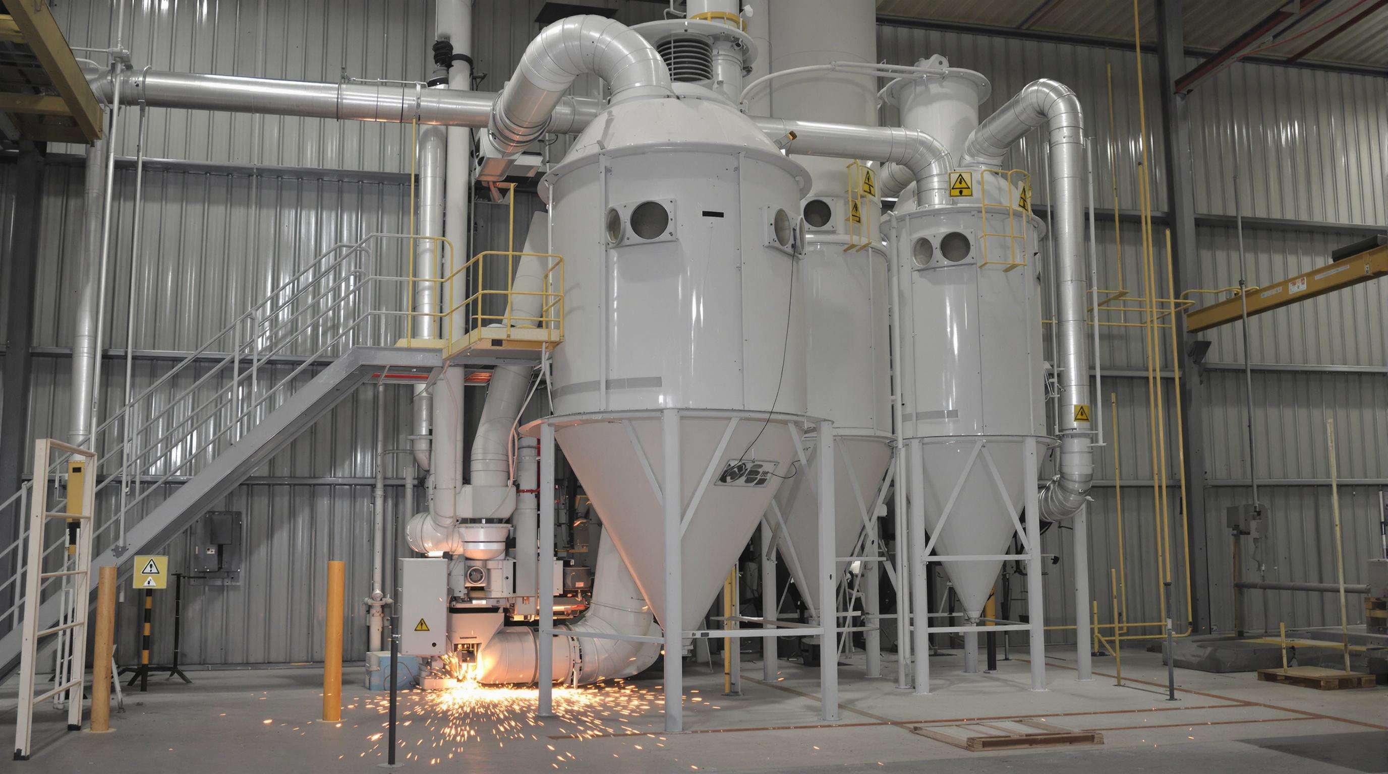 Dust collector system in a metal workshop preventing sparks from igniting hazardous dust