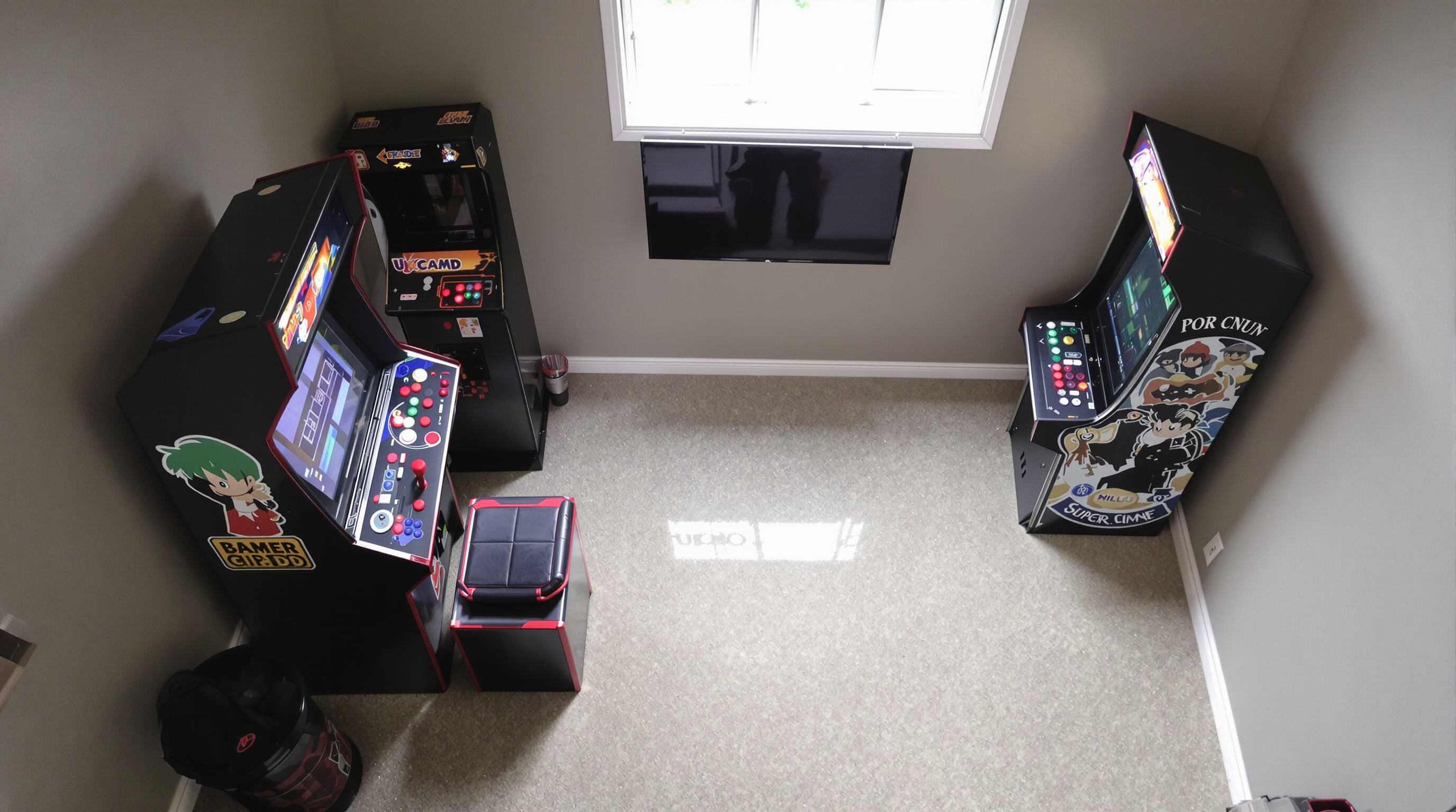 Overhead view of a home game room showing a sit-down arcade machine with a built-in seat and a stand-up arcade cabinet, illustrating their different space requirements.