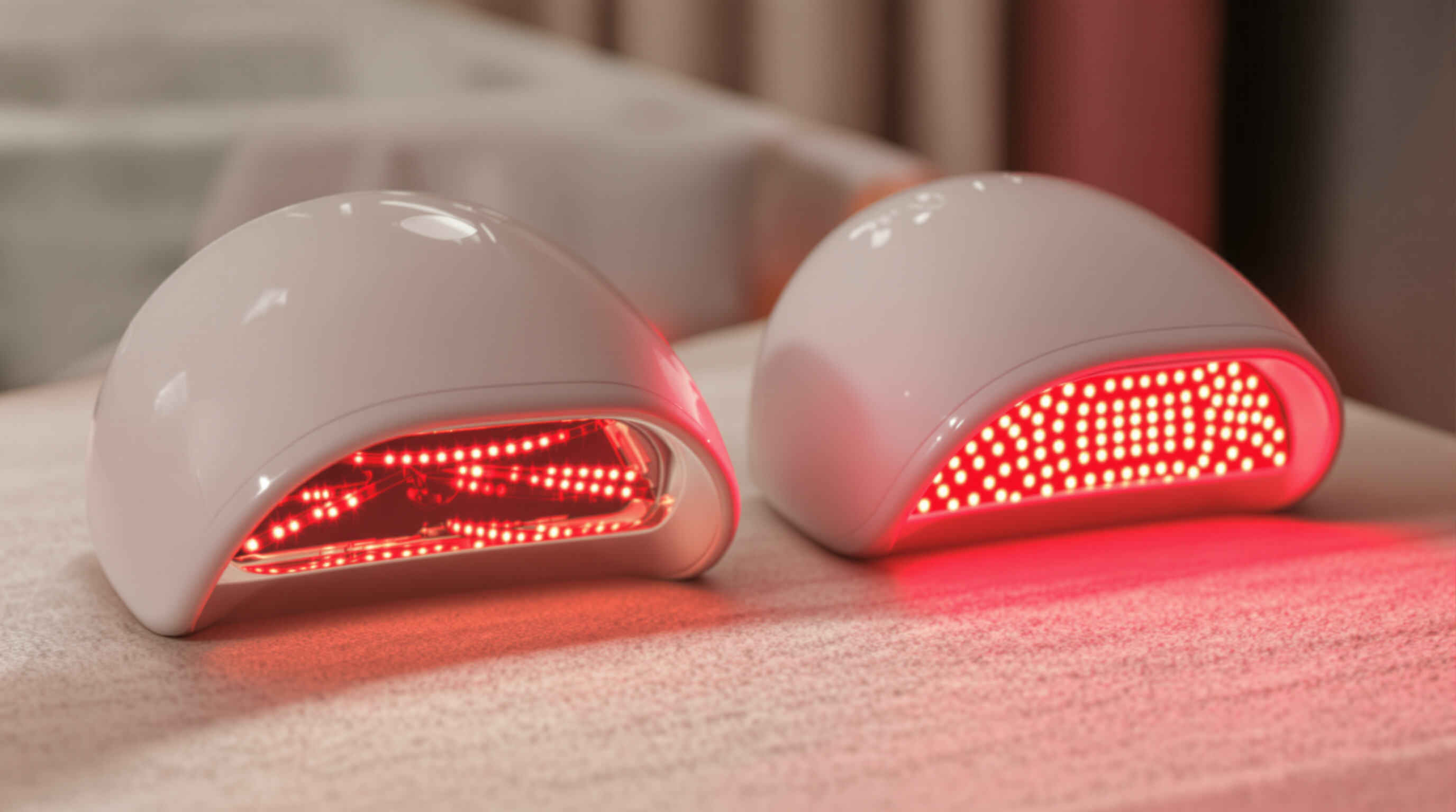 Comparison of two therapy caps illustrating focused laser beams versus diffuse LED glow