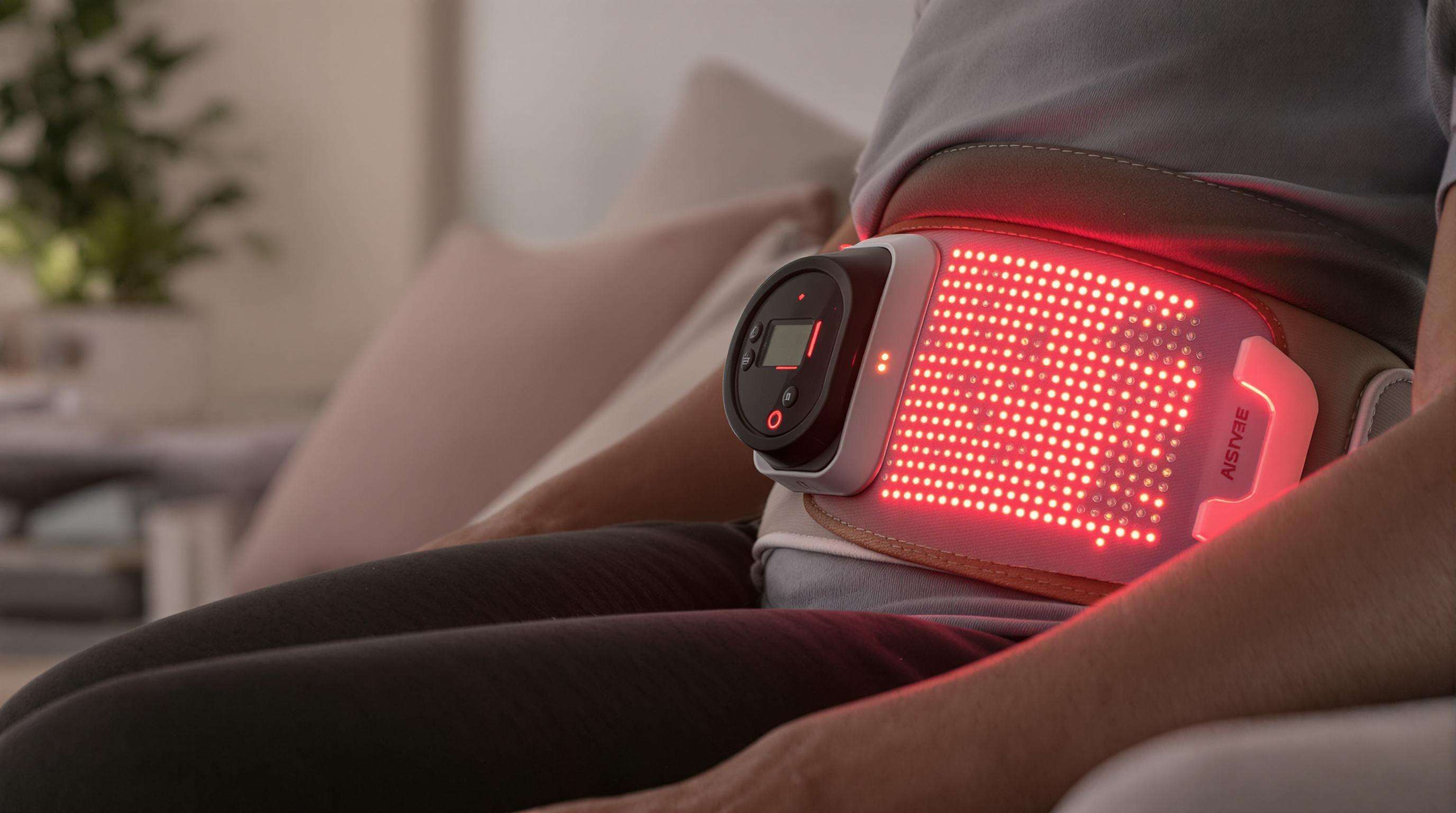 Photorealistic image of a person using a red light therapy belt at home emitting red and infrared light