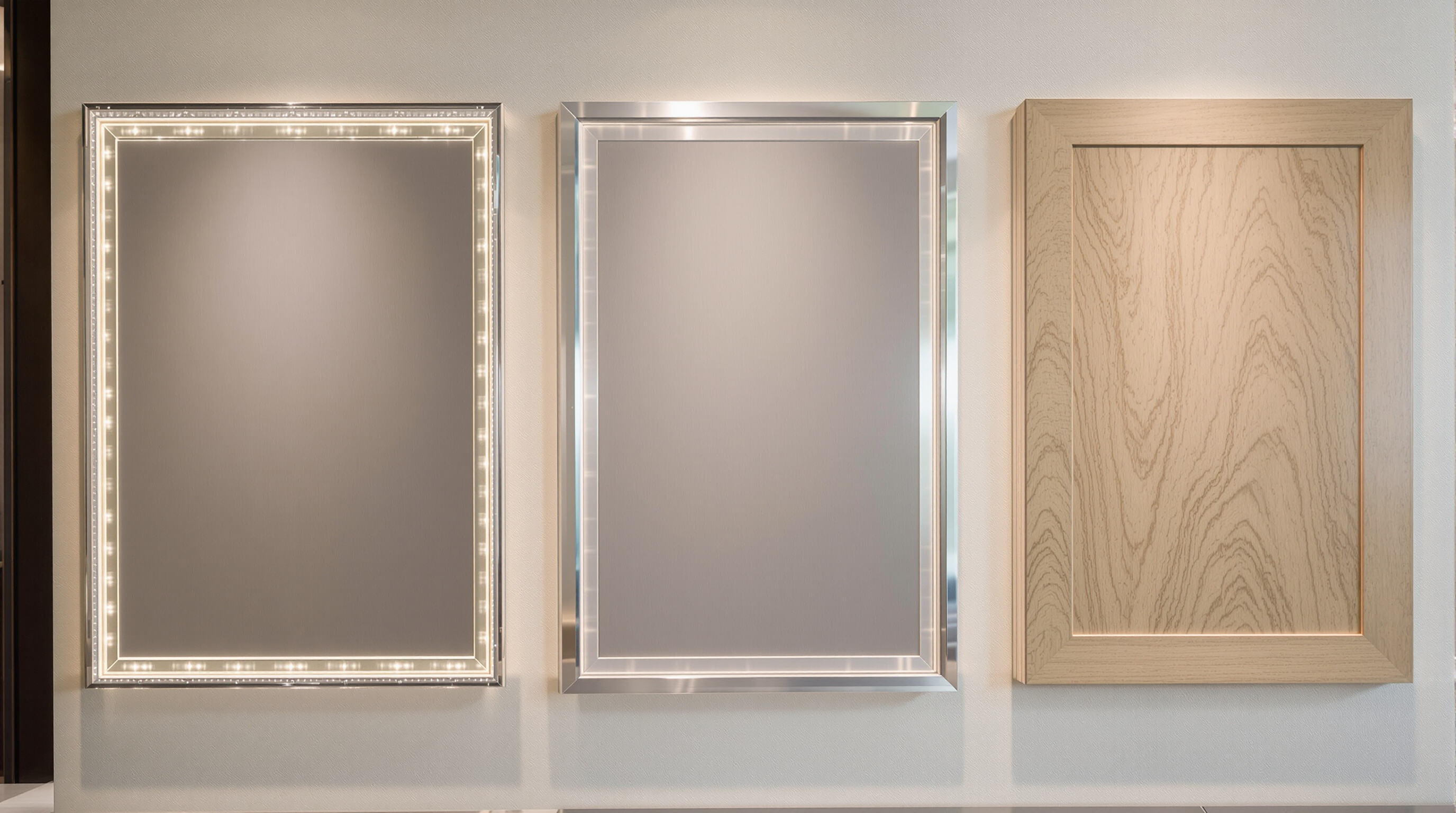 Three types of wall display cabinet materials on display: marine-grade plywood, aluminum composite, and finished oak