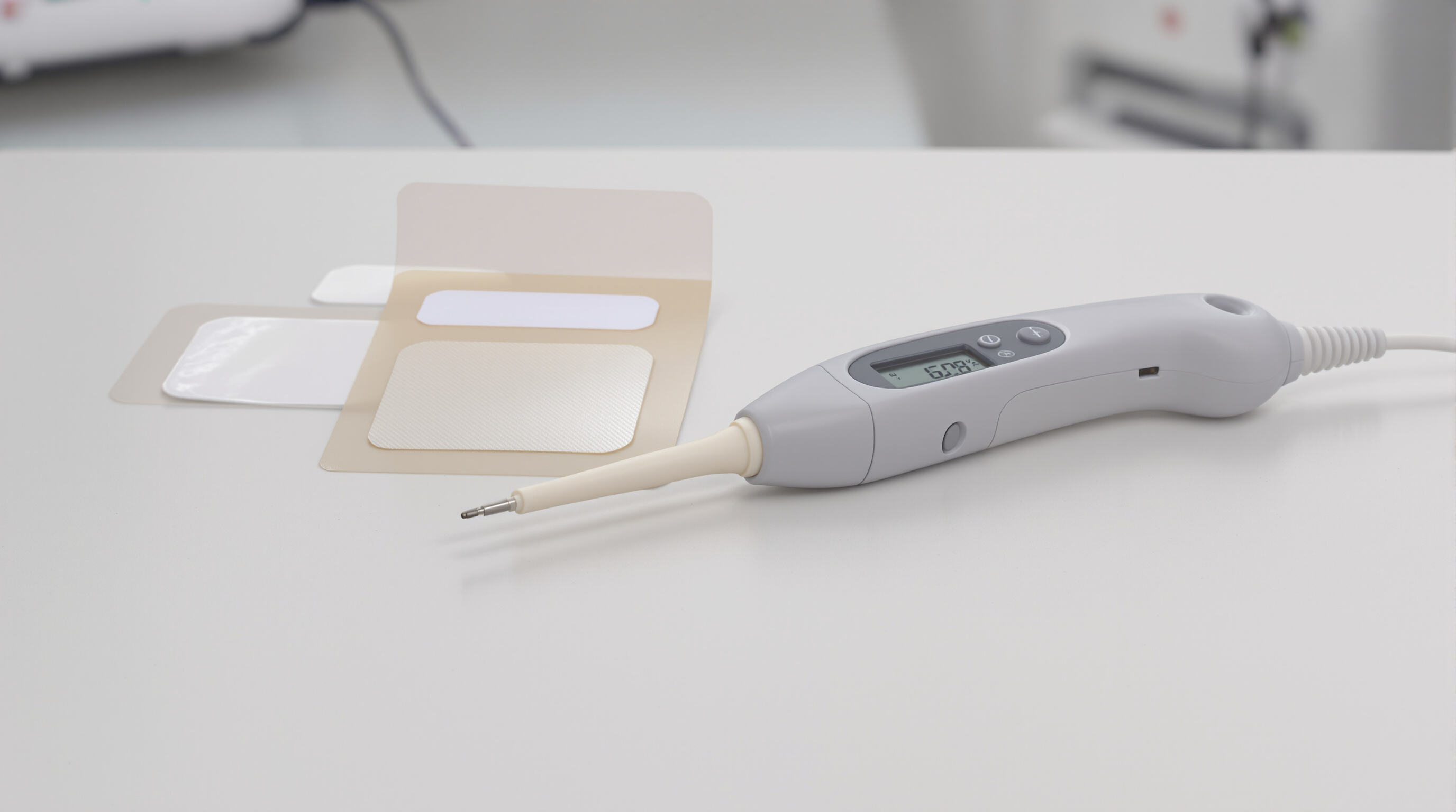 Side-by-side disposable and reusable temperature probes showing different materials and designs