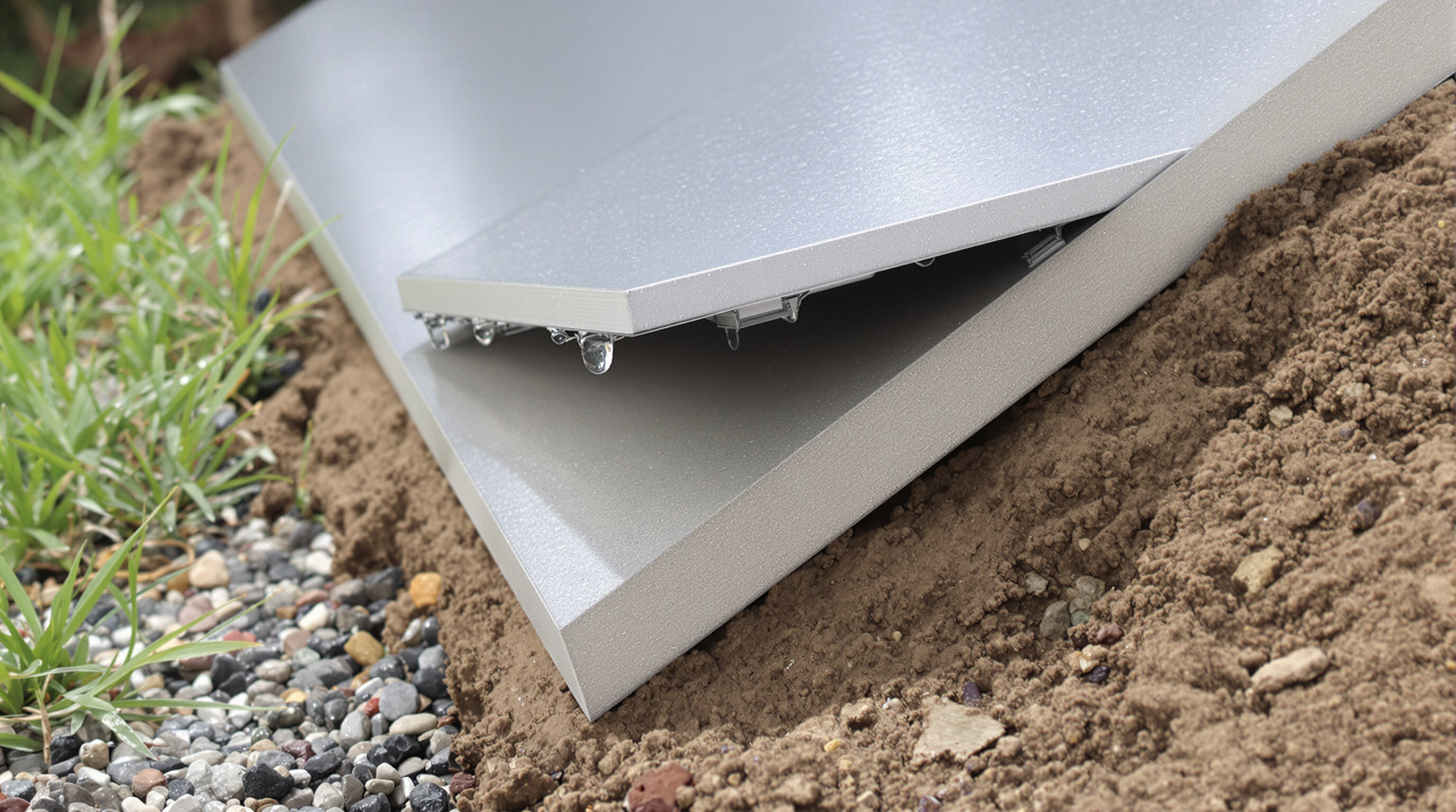 Durable temporary flooring panels installed securely on uneven ground, illustrating weather resistance and reinforced edges.