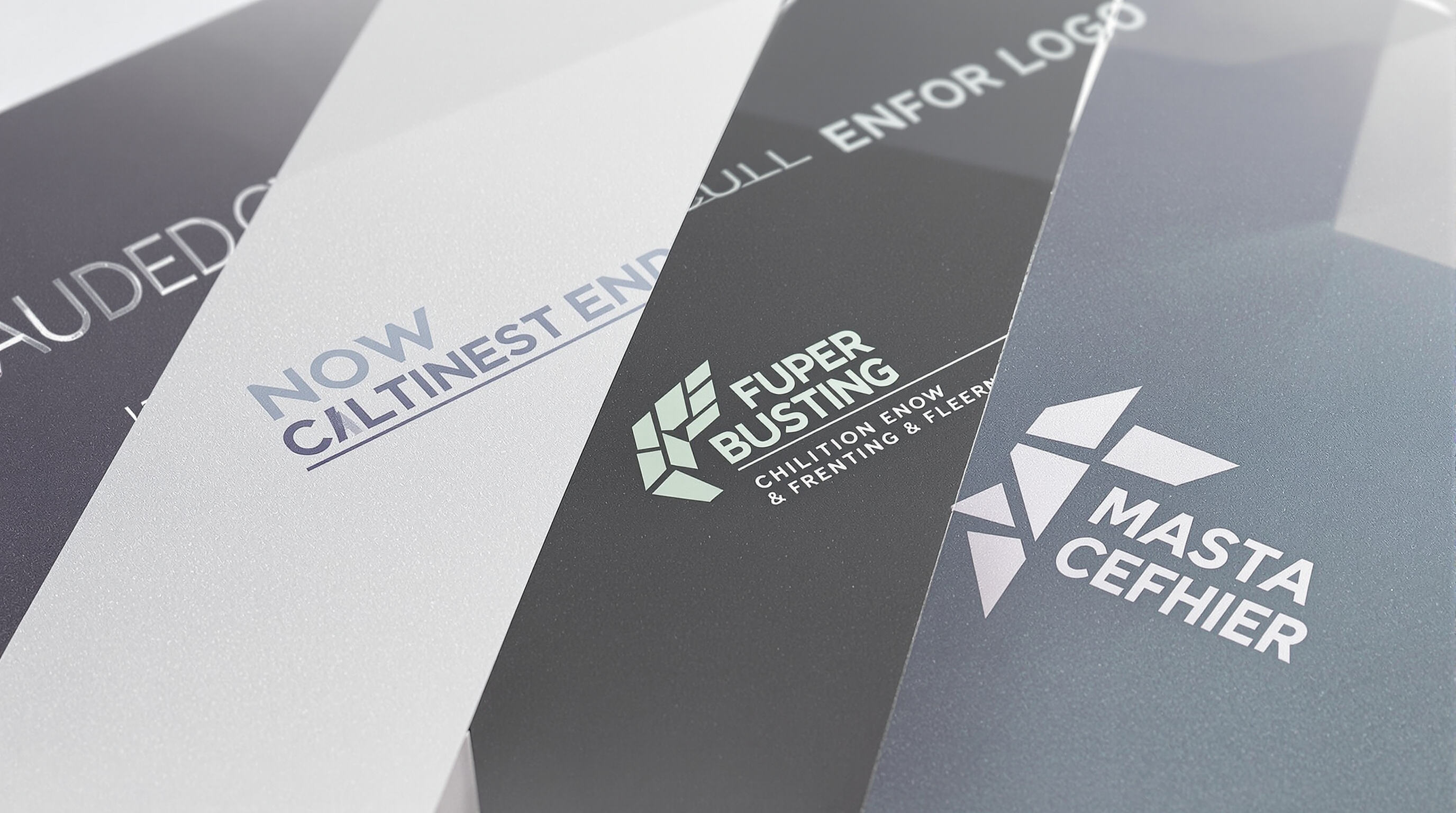 Detailed close-up of silicone pads displaying different logo printing techniques side-by-side in an industrial setting.