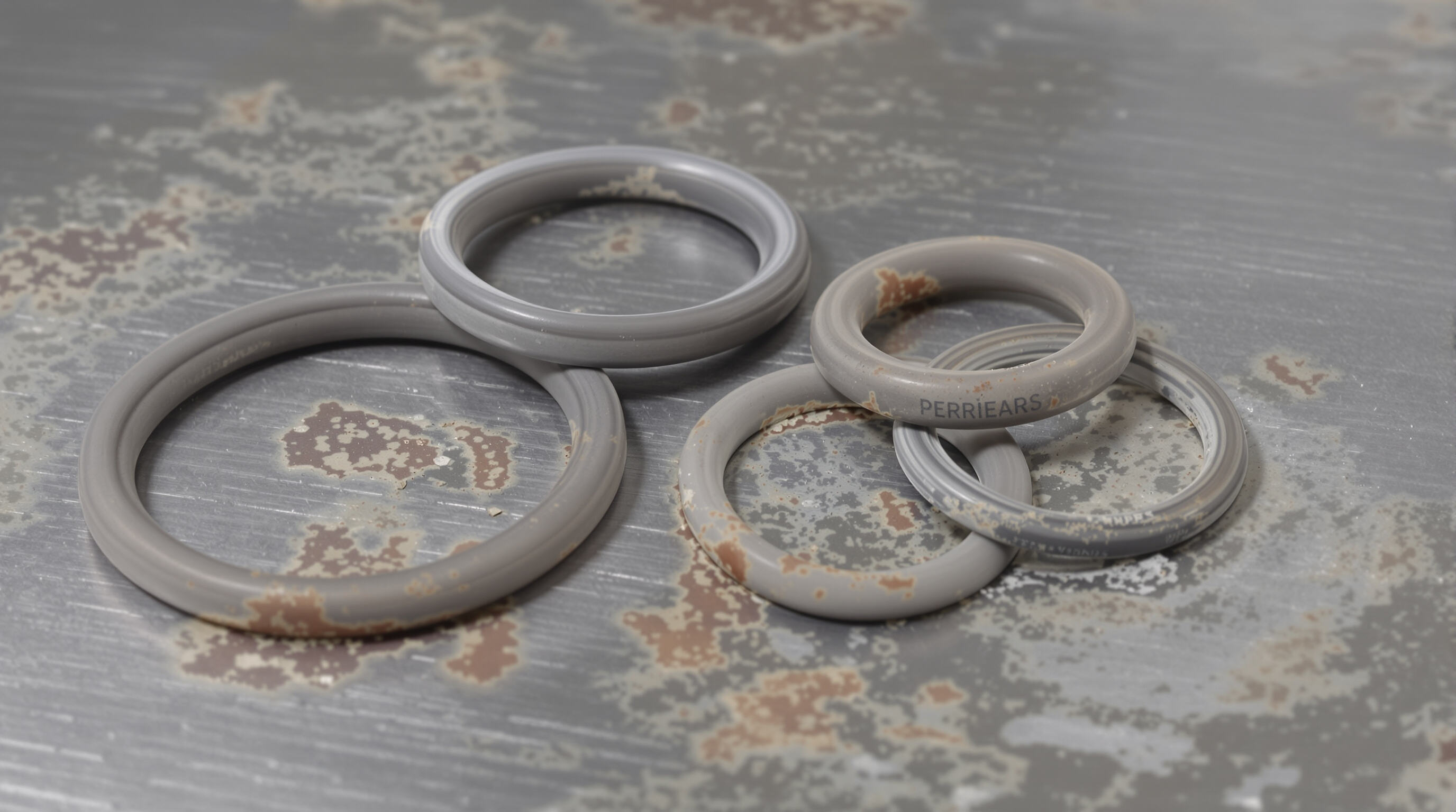 Close-up of various o-rings showing material changes after exposure to heat and cold.