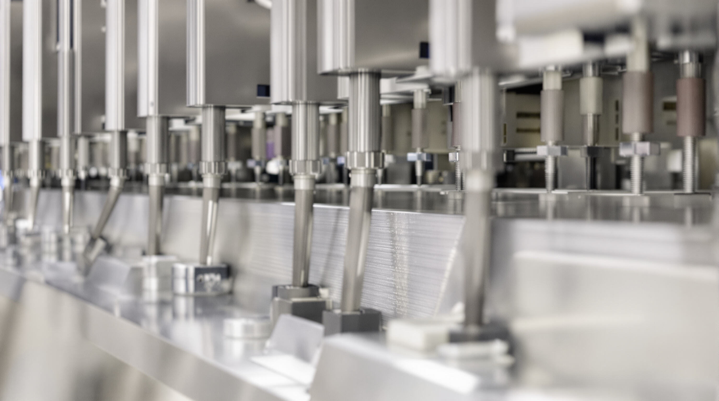 Close-up of sanitized stainless steel vegetable processing equipment with smooth joints and clean surfaces