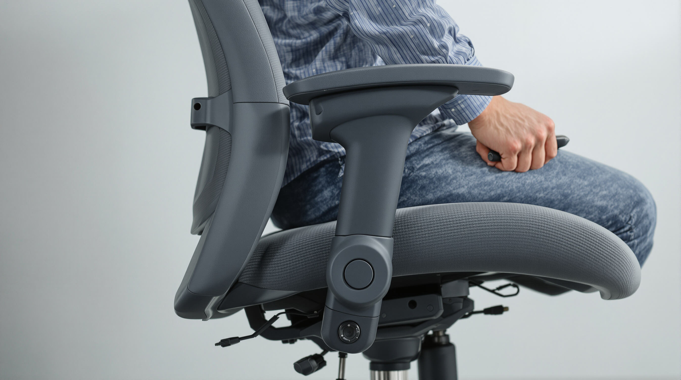 Photorealistic side view of an ergonomic chair showing adjustable features as a person makes seat and armrest changes