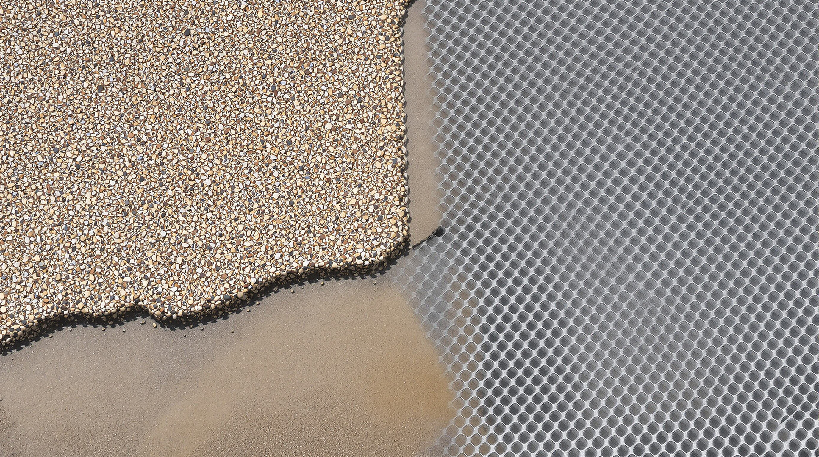 Split aerial view showing gravel with and without a honeycomb stabilizer grid, highlighting erosion control and drainage benefits
