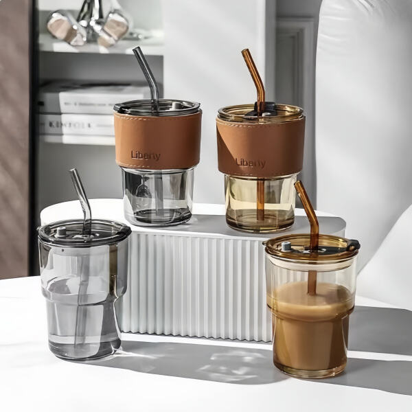 Stylish sipping with a glass, straw, and lid in hand