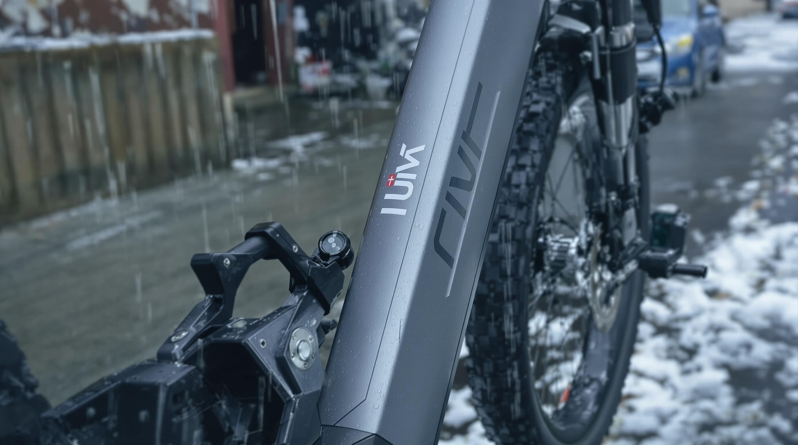 UVI electric bike shown outdoors in harsh weather, emphasizing its durability and weather resistance features.
