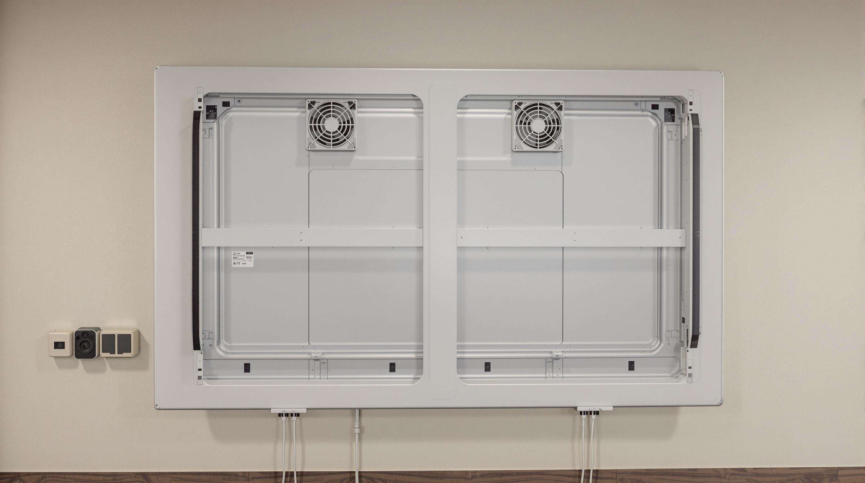 Large LED screen with visible ventilation space, cooling fans, and environmental sensors