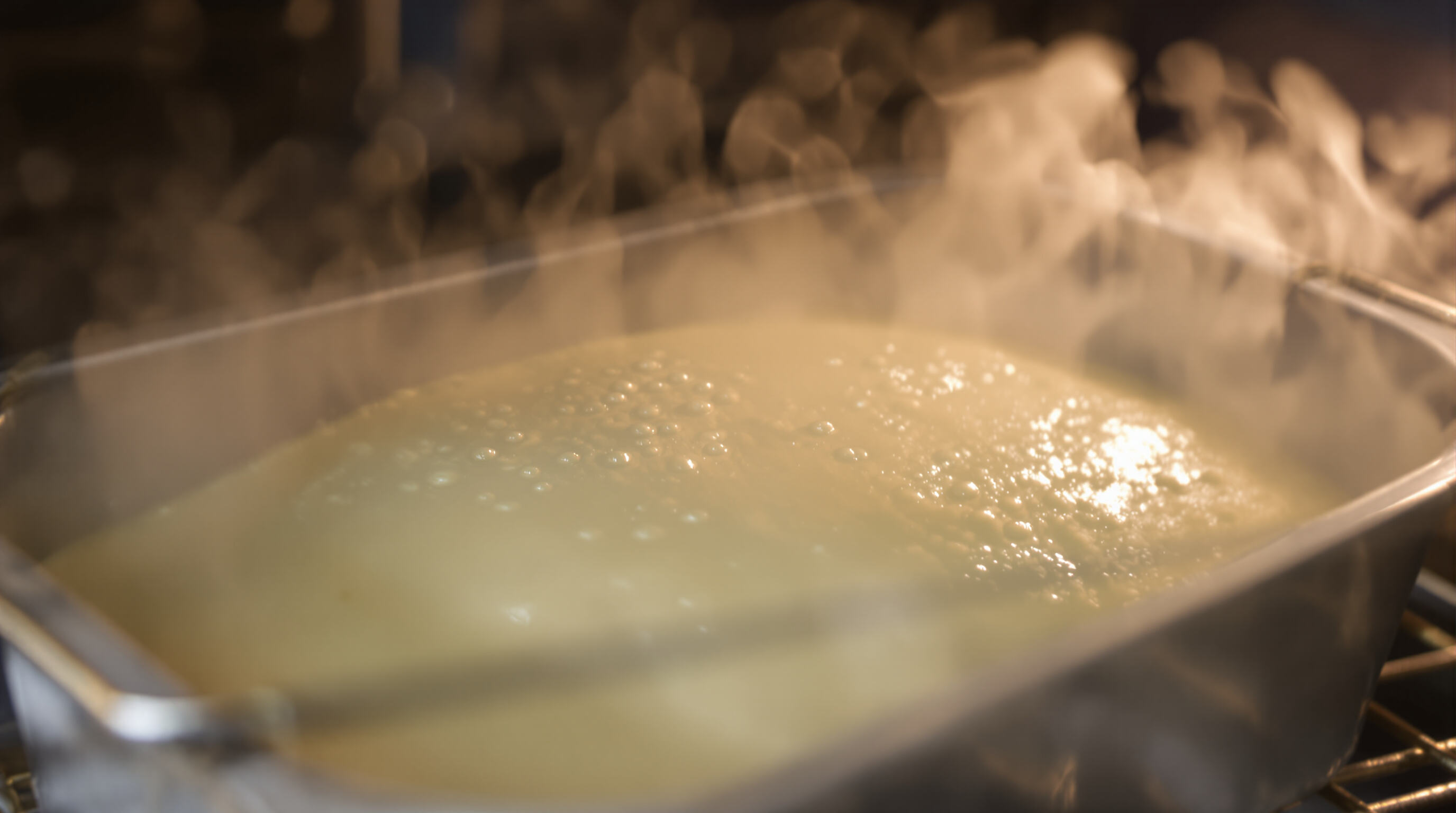 Close-up realistic photo of cake batter rising in a baking pan inside an oven, showing bubbles and steam forming