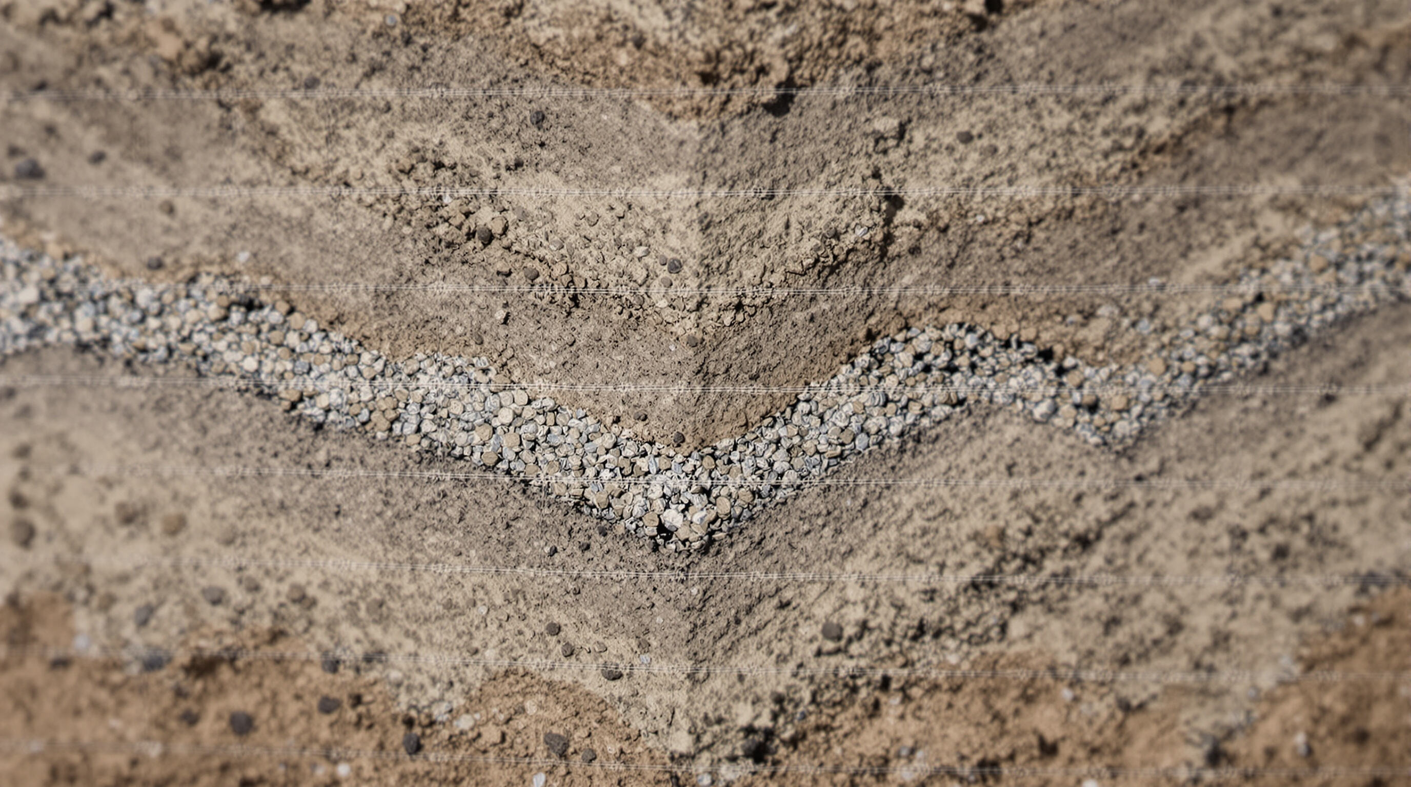 Detailed photorealistic cross-section of soil with geogrid, showing interlocked soil and load distribution