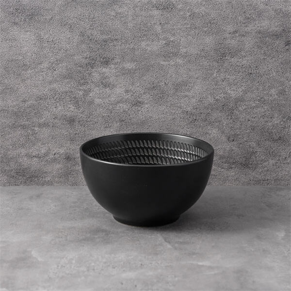 Embrace a modern minimalist look with a black ceramic plate.