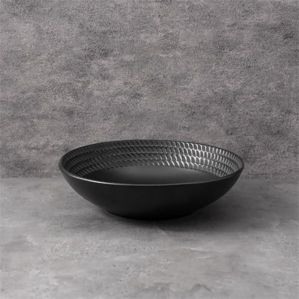 A timeless classic, the black ceramic plate is a staple for any kitchen.