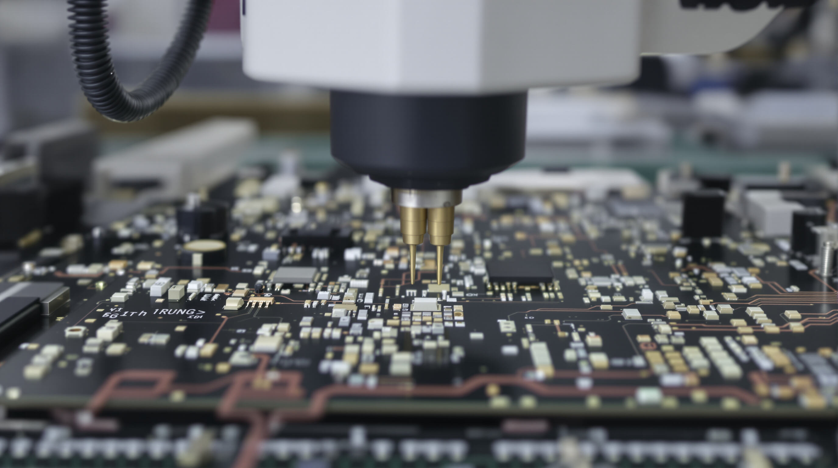 Close-up of SMT pick and place machine precisely placing tiny electronic components onto a circuit board in a factory setting